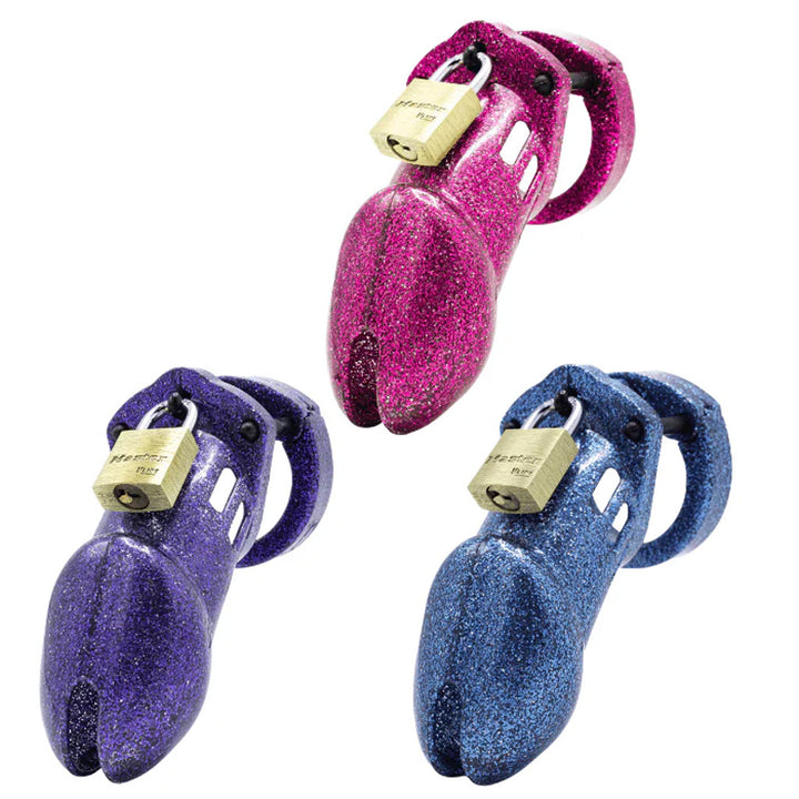 Three locking chastity cages on a white background, each with a sparkly surface in a different color: purple, blue, and pink. Each has a brass Master padlock.
