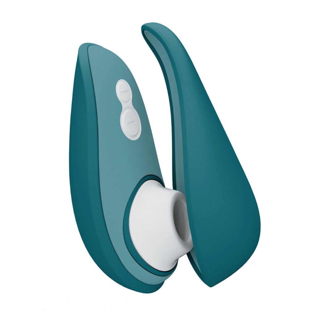 Two teal Womanizer Liberty 2 Vibrators shown on a white background to show the front and the back of the vibe at the same time.