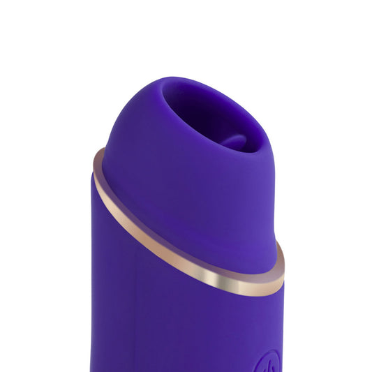 The upper half of the mini clit licking personal vibrator standing vertically, showing the top of the head. 