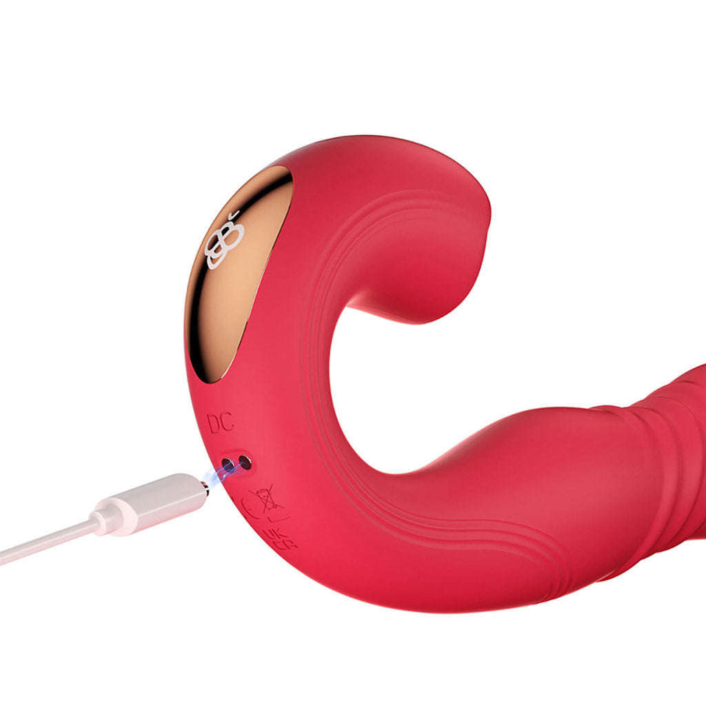 Close-up of the Joi G-spot vibrator's handle and charging port, with a cable almost touching the port. 