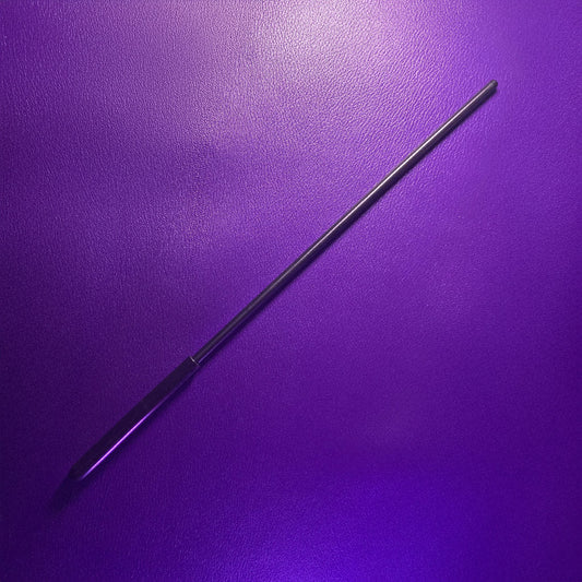 A black 12-inch Delrin cane is shown against a purple leather background. 