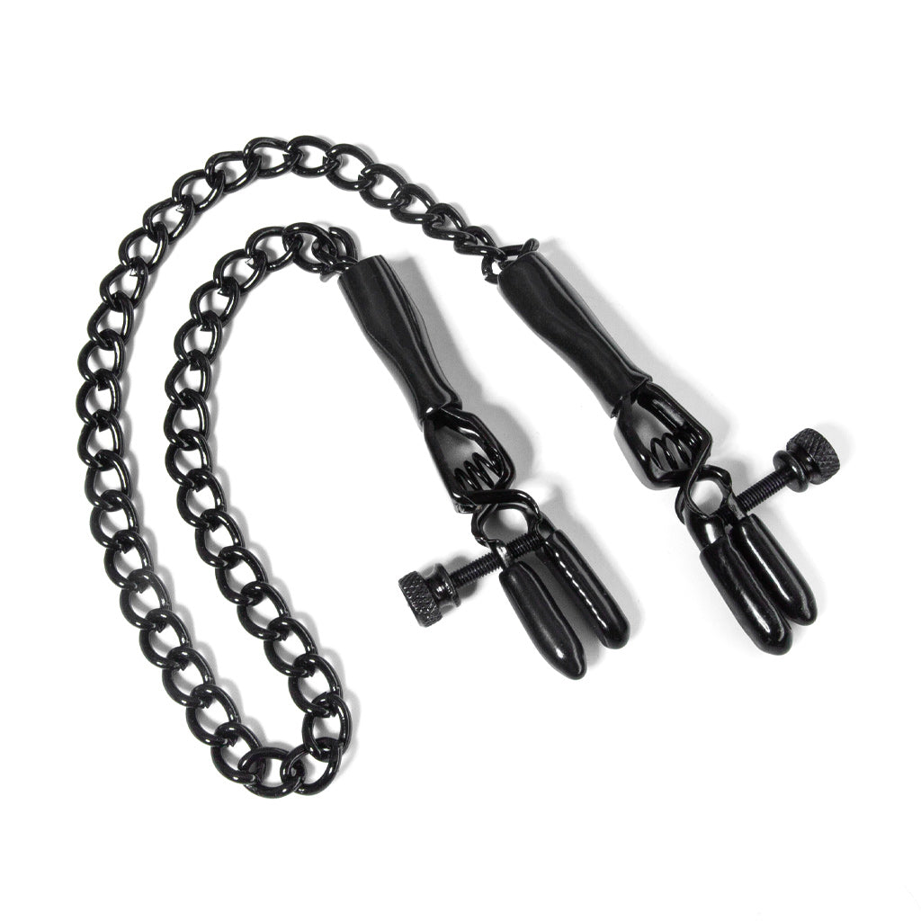 The black spring jaw nipple clamps are shown laying against a white background