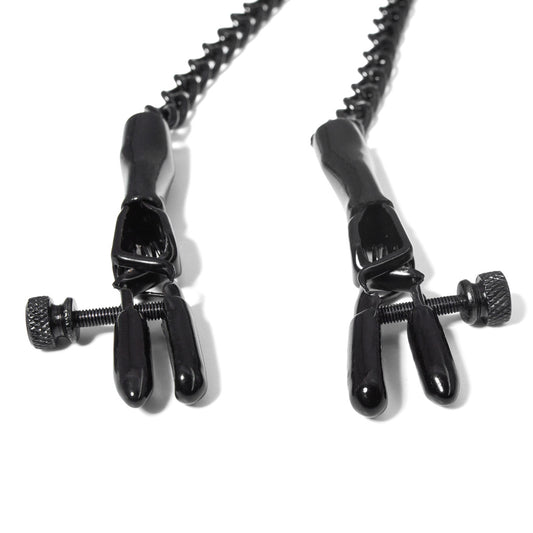 The black spring jaw nipple clamps are shown laying against a white background
