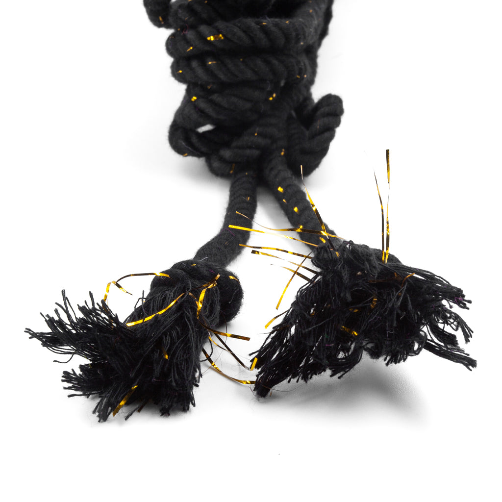 the knotted ends of the black bamboo silk conductive rope are shown on a white background.