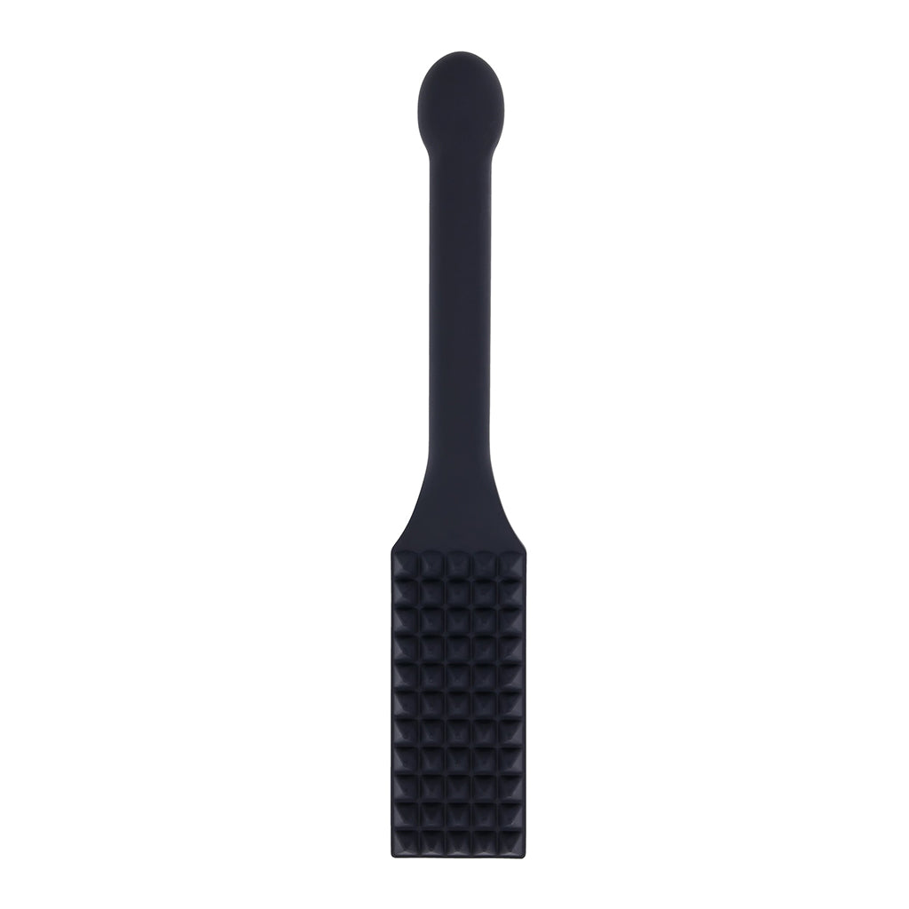 Black silicone paddle with textured surface on a white background