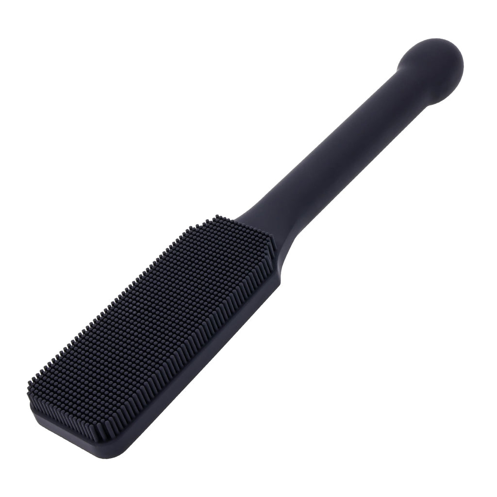 Black paddle brush on a white background