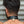 Load image into Gallery viewer, A close-up of the back of a brunette man’s neck is shown. He wears the Locking Leather Collar, which is locked shut with a brass padlock.
