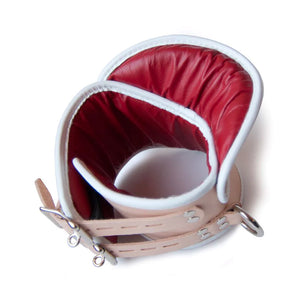 The Deluxe Padded Medical Leather Posture Collar is shown from above, displaying the red leather interior lining.