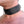 Load image into Gallery viewer, A close-up of a man&#39;s neck in the BDSM Black Leather Collar with Locking Buckle is shown. The collar is made of a wide strip of black leather with a smaller notched strip in the center. It has a metal D-ring in the center.
