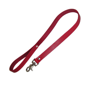 The red leather leash is shown against a blank background. It is made of a thin strip of red leather with a wrist loop at one end and a metal snap hook on the other.