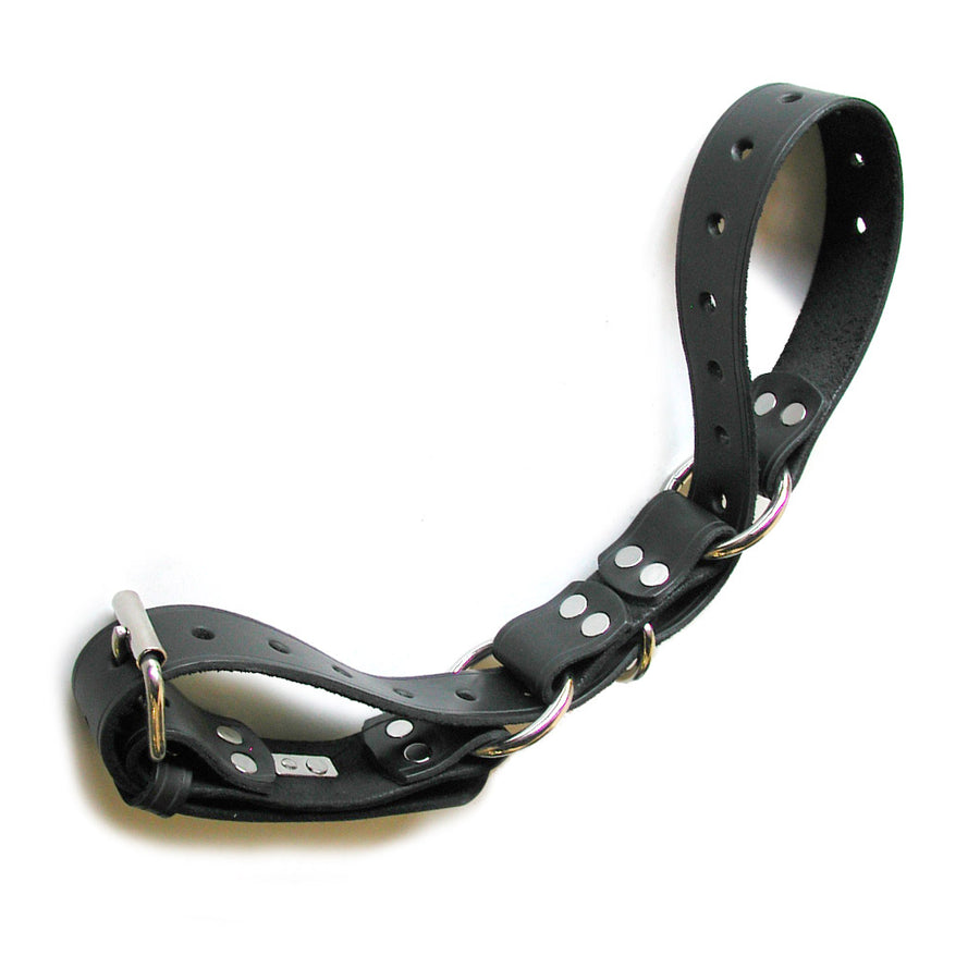 The black Leather Hobble Belt with silver hardware is shown against a blank background. The belt has been looped through the various rings on the belt to create a linked cuff shape.