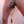 Load image into Gallery viewer, A close-up of a nude man’s pierced penis is shown. He is wearing the Spiked Parachute Ball Stretcher, which has a weight attached to the chains hanging off of it, pulling his balls downwards.
