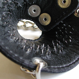 A close-up of the interior of the Spiked Parachute Ball Stretcher is shown against a blank background. The inside is lined with small metal spikes.