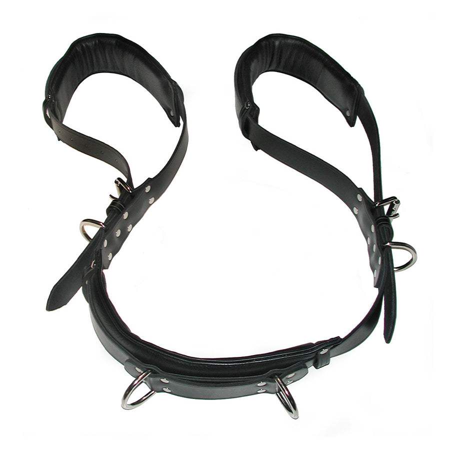 The Deluxe Portable Leather Thigh Sling is shown lying flat against a blank background. The sling is a thick strip of black leather with an adjustable loop on each end. The sling has metal hardware, with a D-ring at each loop and two in the middle.