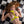 Load image into Gallery viewer, A nude woman with red hair splayed around her lays on a black and white checkered floor. She is wearing the yellow Neon Angel Bust Harness The harness is made of leather with silver hardware, including a D-ring on the collar and between her breasts.
