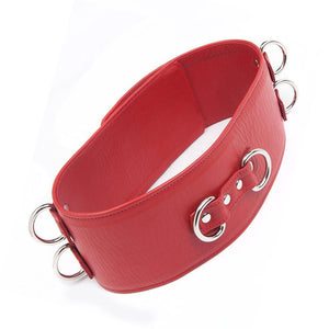 A red Premium Garment Leather BDSM Locking Waist Cuff is shown from the back against a blank background. The back of the cuff has two D-rings next to each other, centered in the middle of the cuff.