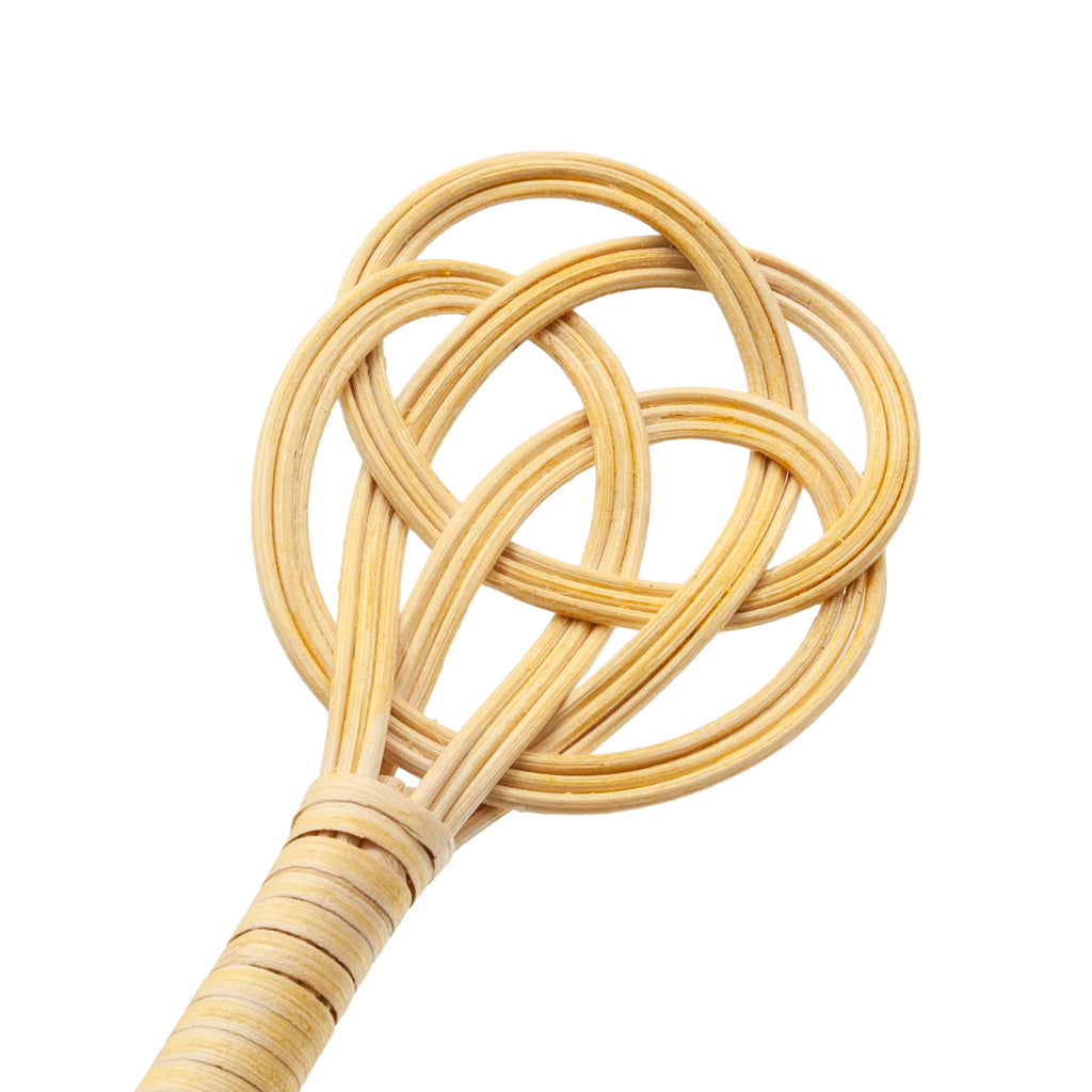 A close-up of the top of the ball beater is shown against a white background. 