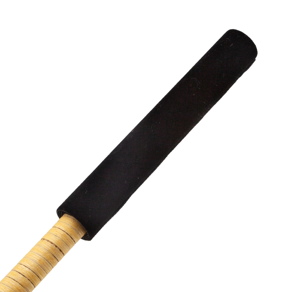 A close-up of the handle of the ball beater is shown against a white background. 