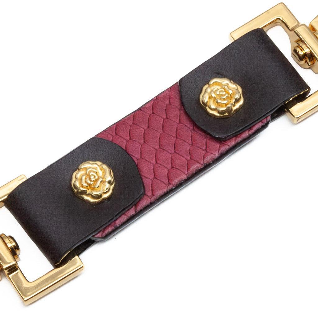 The Melanie Rose Designs x The Stockroom Restraint Clip is displayed against a black background. 