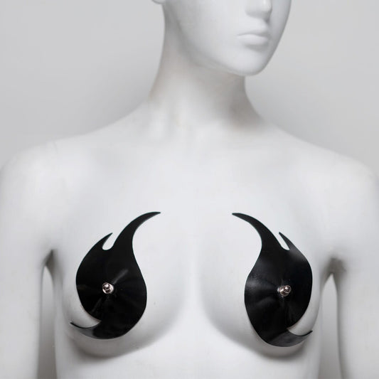 Black flame-shaped pasties on a mannequin bust against a white background