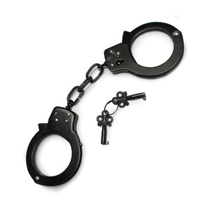 The black Kinklab Basic Handcuffs are displayed against a blank background along with their keys. They resemble basic police cuffs with a short connecting chain.