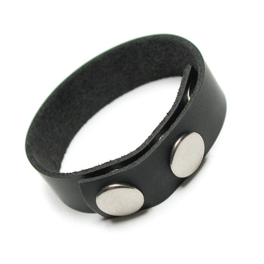 The black leather KinkLab 3 Snap Cock Ring, made of a thin strip of leather with adjustable snap closures, is displayed against a blank background.