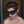 Load image into Gallery viewer, A close-up of a brunette man with facial stubble is shown wearing the Kinklab Padded Blindfold.
