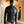 Load image into Gallery viewer, A brunette man wearing the Deluxe Rubber Straitjacket is shown from behind, standing in front of a mirror. The back of the jacket has a metal zipper in the center as well as three horizontal buckles across the back and one around the neck.
