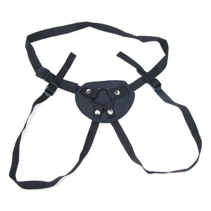 The Malibu Terra Firma Strap-on harness is displayed against a blank background. The harness straps are made of black neoprene with plastic adjustable buckles. The straps loop through the front piece of the harness and around the O-ring to secure it.