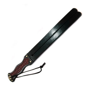 The English Tawse is displayed against a blank background. It has a thin wrist loop. 