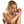 Load image into Gallery viewer, A topless blonde woman is shown from the waist up in front of a blank background with her arms held up in front of her and her wrists wrapped together with pink Bondage Tape.
