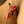 Load image into Gallery viewer, A close-up of a man’s penis is shown inside the transparent red chastity cage from the CB-3000 Complete Male Chastity Package. The cage is shaped like a flaccid penis and covers the shaft, connecting to a ring placed behind the balls, and closed with a plastic lock.
