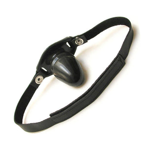 The Tantus Silicone Fantasy Penis Gag is displayed against a blank background. The gag is made of black silicone shaped like the head of a penis, and is attached to black leather velcro straps.