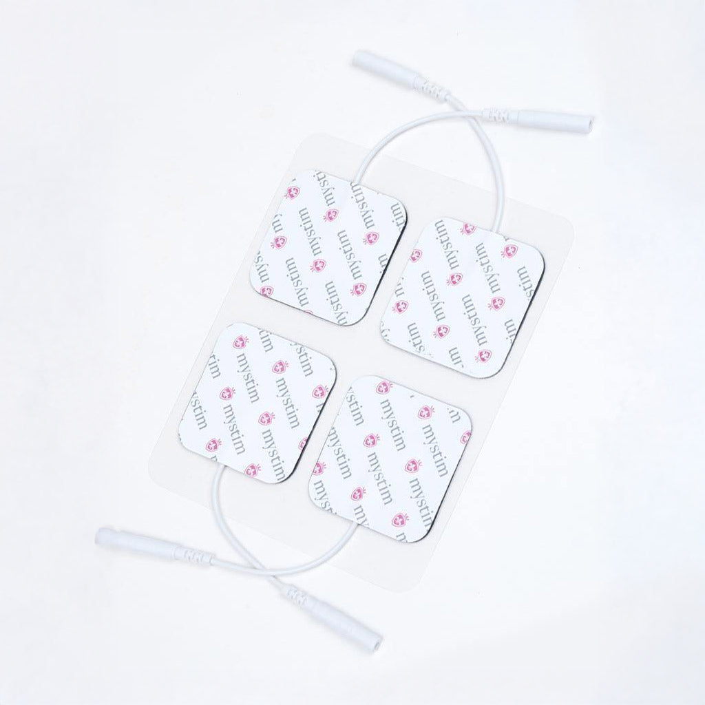  A set of four Mystim Electrodes, which are white squares with cords, are displayed against a blank background.