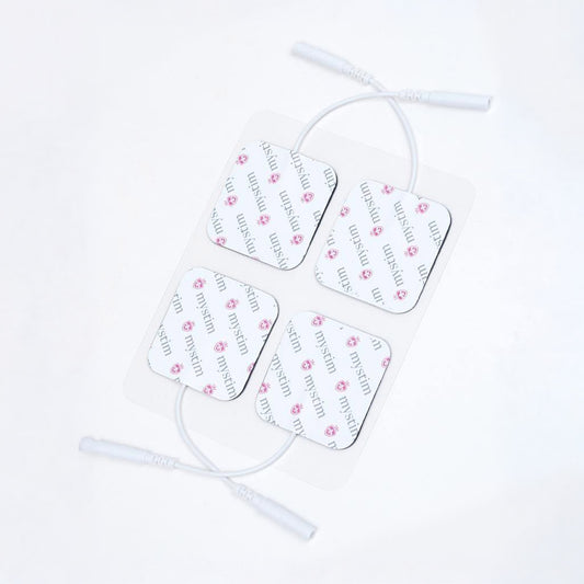  A set of four Mystim Electrodes, which are white squares with cords, are displayed against a blank background.