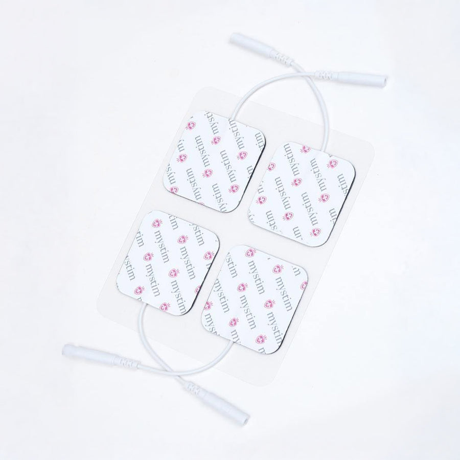  A set of four Mystim Electrodes, which are white squares with cords, are displayed against a blank background.