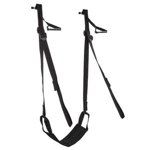 The Door Jam Sex Sling is shown against a blank background. It looks like a swing and has a seat made of black fabric. It has black nylon straps and handles.