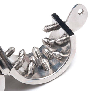 A close-up of one half of Mike's Spikes Cock & Ball Torture Device is shown open against a blank background.