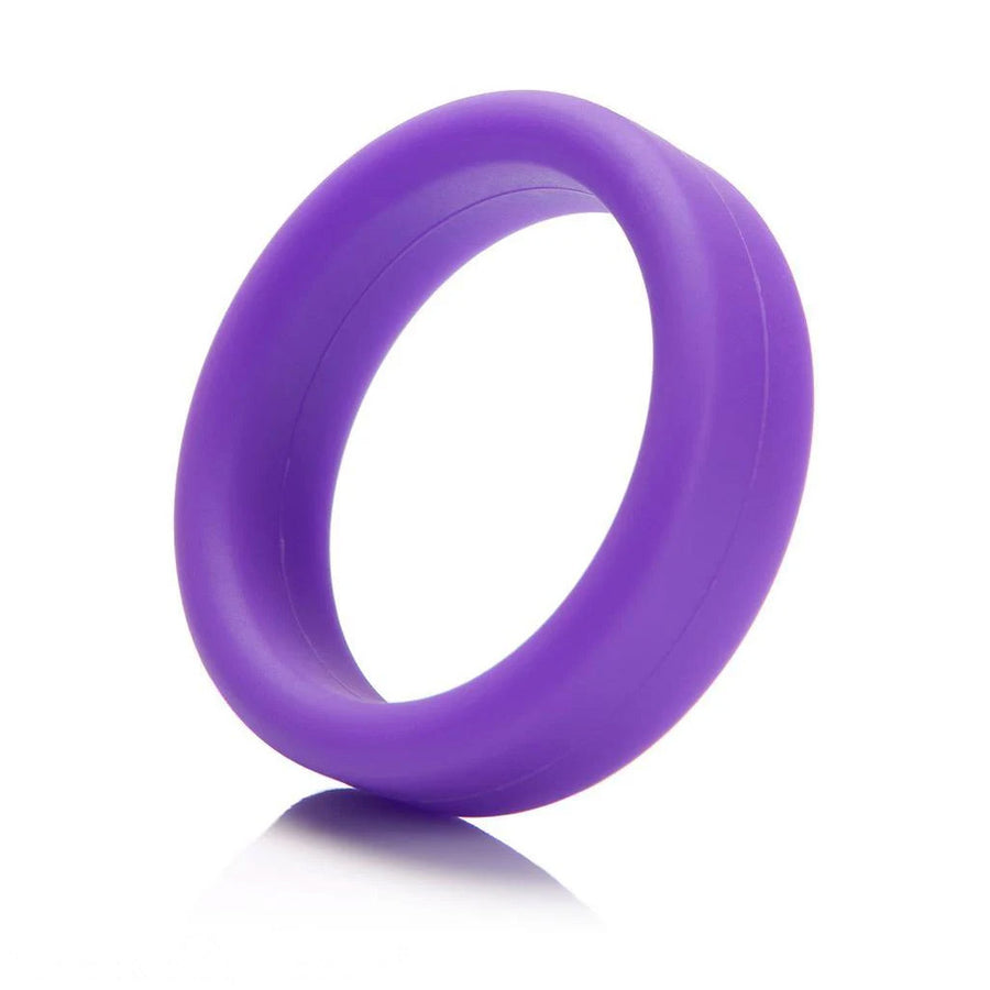 A Tantus Super Soft C-Ring in purple is displayed against a blank background. It is a ring made of a thick band of matte purple silicone.