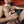 Load image into Gallery viewer, A close-up of a sitting man shows him holding the Electrastim &quot;Jack Socket&quot; Electro Stroker near his penis with two wires plugged into the top of the stroker.
