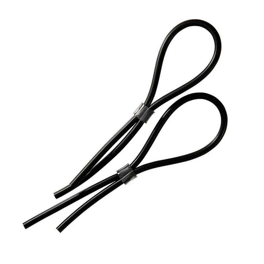 The Electrastim Rubber Adjustable Cock And Scrotal Loops are shown against a blank background. There are two loops, and they are made of a black silicone cord that is bent in half to make a loop and held together with a metal bolo fastener.