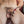 Load image into Gallery viewer, A close up of a man’s penis is shown with one red Electrastim Electraloop Prestige fastened around his balls and one behind the head of his penis.
