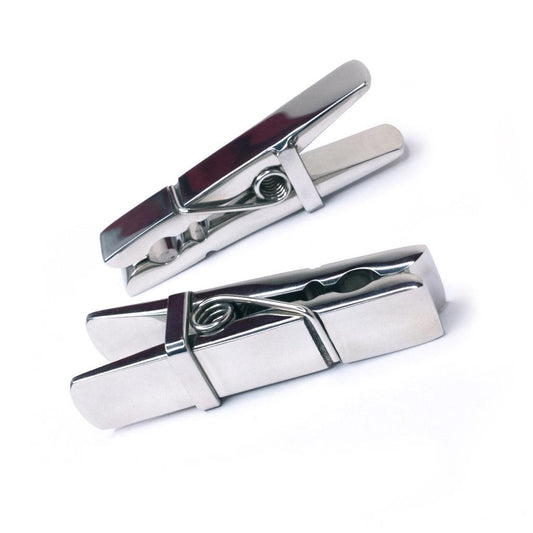 The Stainless Steel Clothespin Nipple Clamps are shown against a blank background. They look exactly like clothespins, but are entirely made of shined stainless steel.