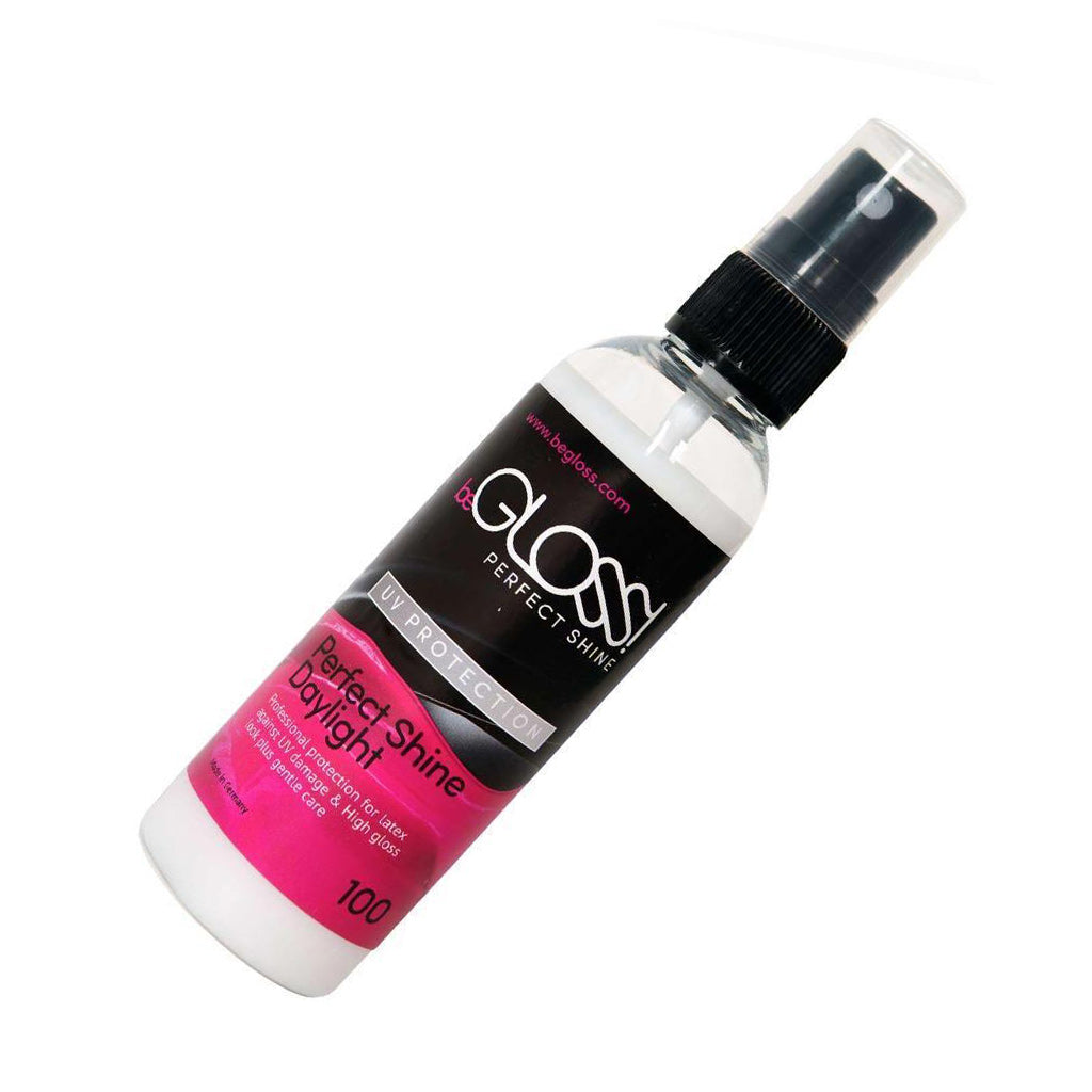 A bottle of the beGLOSS Daylight UV Protection Spray is shown against a white background.