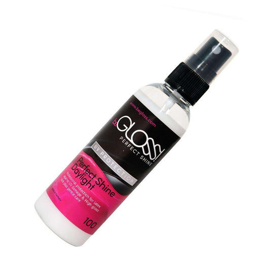 A bottle of the beGLOSS Daylight UV Protection Spray is shown against a white background.