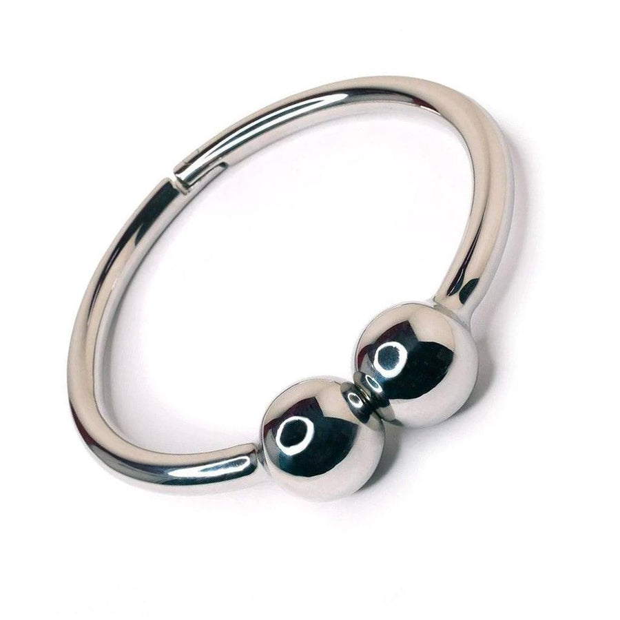 The Magnetic Barbell Stainless Steel Collar is displayed against a blank background. The collar is made of a circular piece of shiny, silver stainless steel with two large magnetic balls in the center.