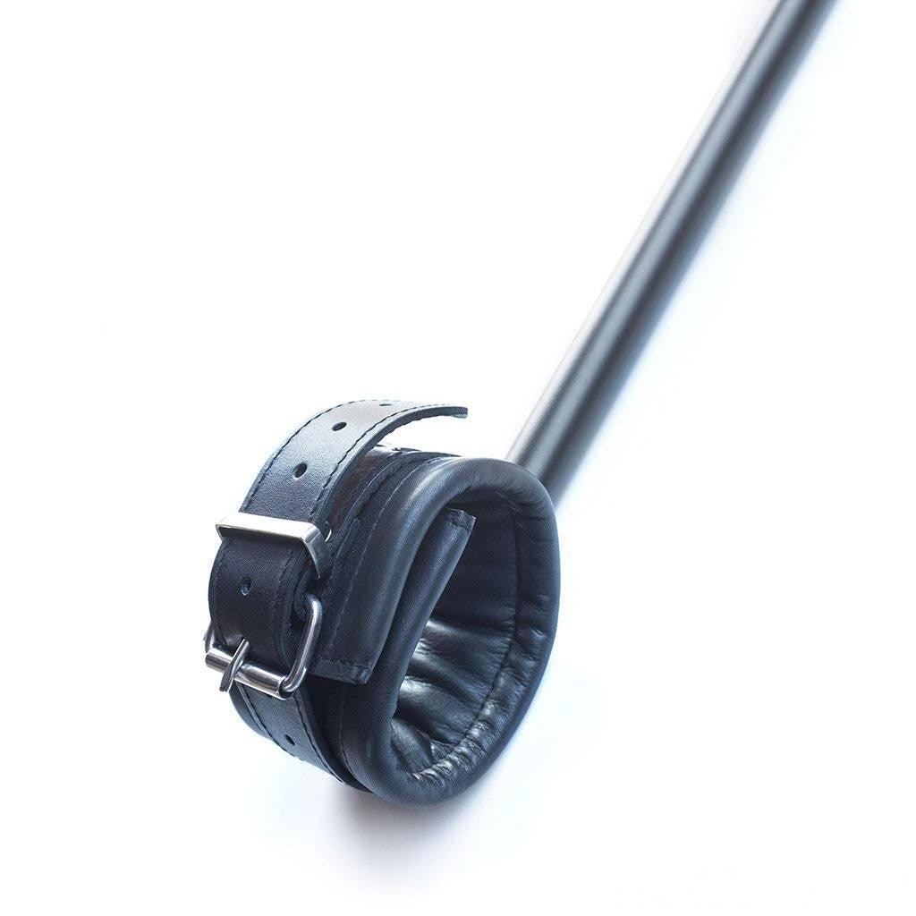 A close-up of one of the black leather cuffs on the Deluxe Pranger Pillory 4-Point Spreader Bar is shown against a blank background.