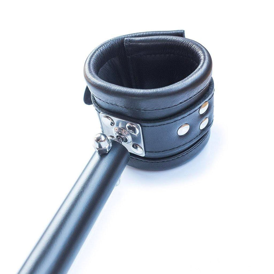 A close-up of one of the black leather cuffs on the Deluxe Pranger Pillory 4-Point Spreader Bar is shown against a blank background.
