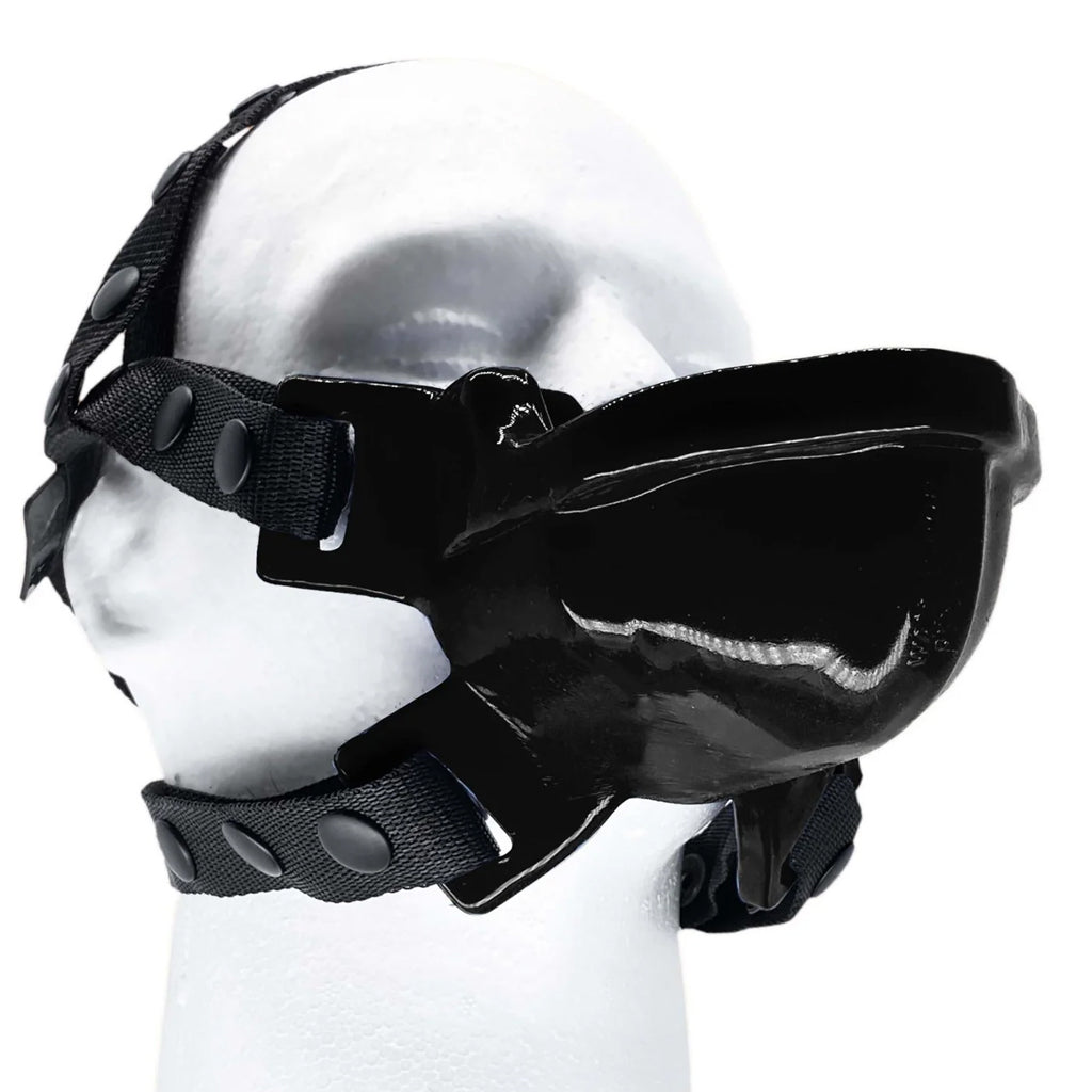 The black Watersport Mouth Gag With Adjustable nylon Straps from Oxballs is displayed on a mannequin against a blank background. The gag has a trough in the front which leads to the cylindrical gag. 
