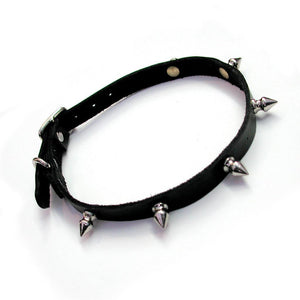 The BDSM Spiked Leather Choker with a D-Ring is shown against a blank background. The spikes on the collar have flat backs on the collar's interior.